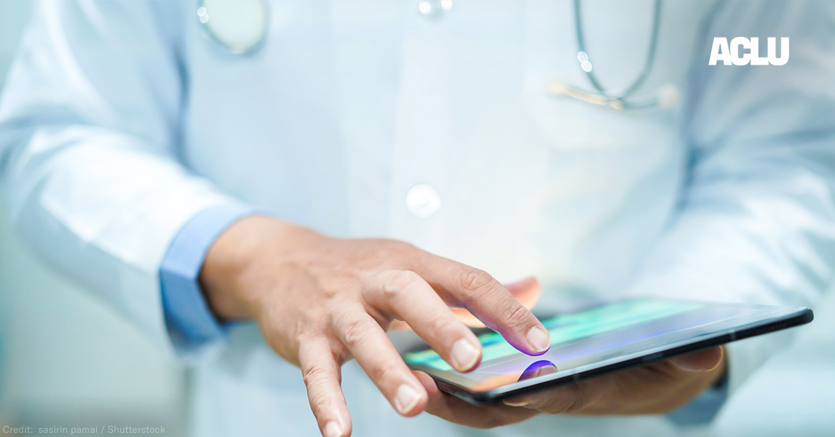 A doctor using a tablet